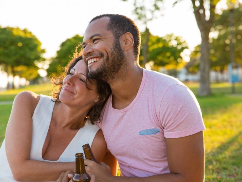 happy-couple-enjoying-outdoor-date-sunset